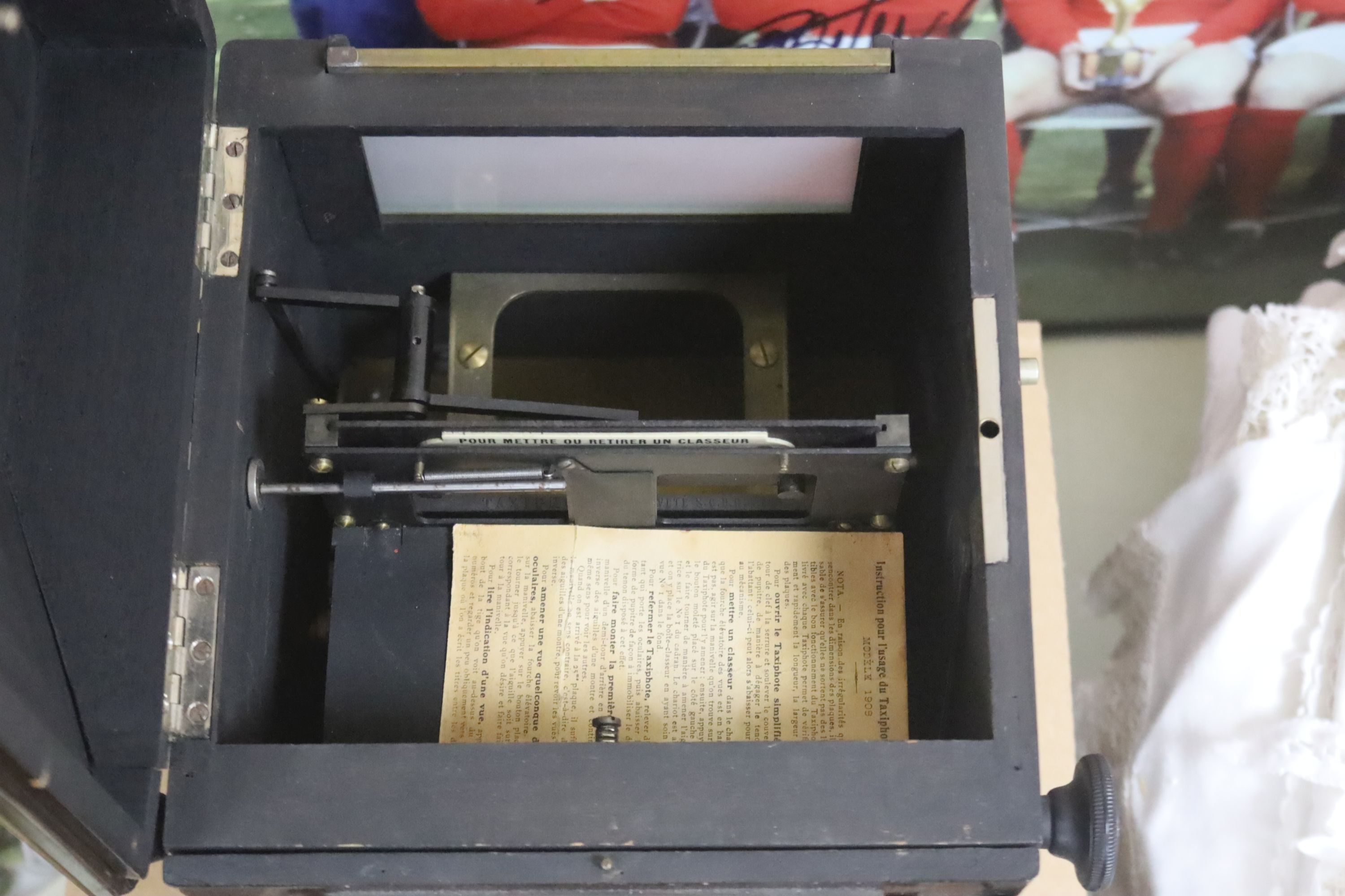 A late 19th century French mahogany cased stereoscopic Taxiphote viewer, together with a cabinet housing glass slides, height 46cm